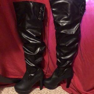 NWOT  black tall shaft high heel boots.
